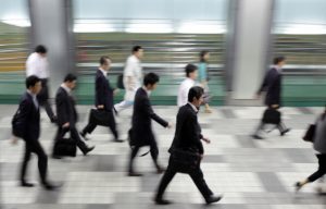 Morning commuters make their way to work in Tokyo, Japan, on Tuesday, May 29, 2012. Japan's jobless rate unexpectedly rose and retail sales fell for a second month, underscoring concern that an economic recovery will lose momentum in the face of gains in the yen and Europe's debt crisis. Photographer: Tomohiro Ohsumi/Bloomberg via Getty Images